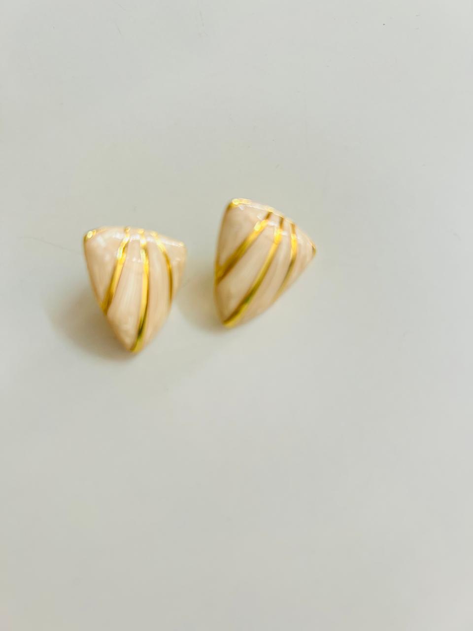 Elegant sculpted shell studs designed to elevate everyday looks—from brunch dates to festive dinners.